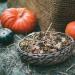 Squash and basket of flower buds representing Thanksgiving.