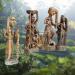 Four orisha African ancestor statues in front ofWest Indian landscape