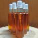 Golden Frankincense Bath & Body oil in a clear glass bottle with serum pump