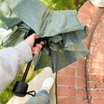 woman opens Umbrella: Le Frenchy Dotted