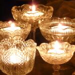 Beeswax Tealight candles burning in glass cups