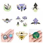 A collage of enamel pins with faeries and bugs